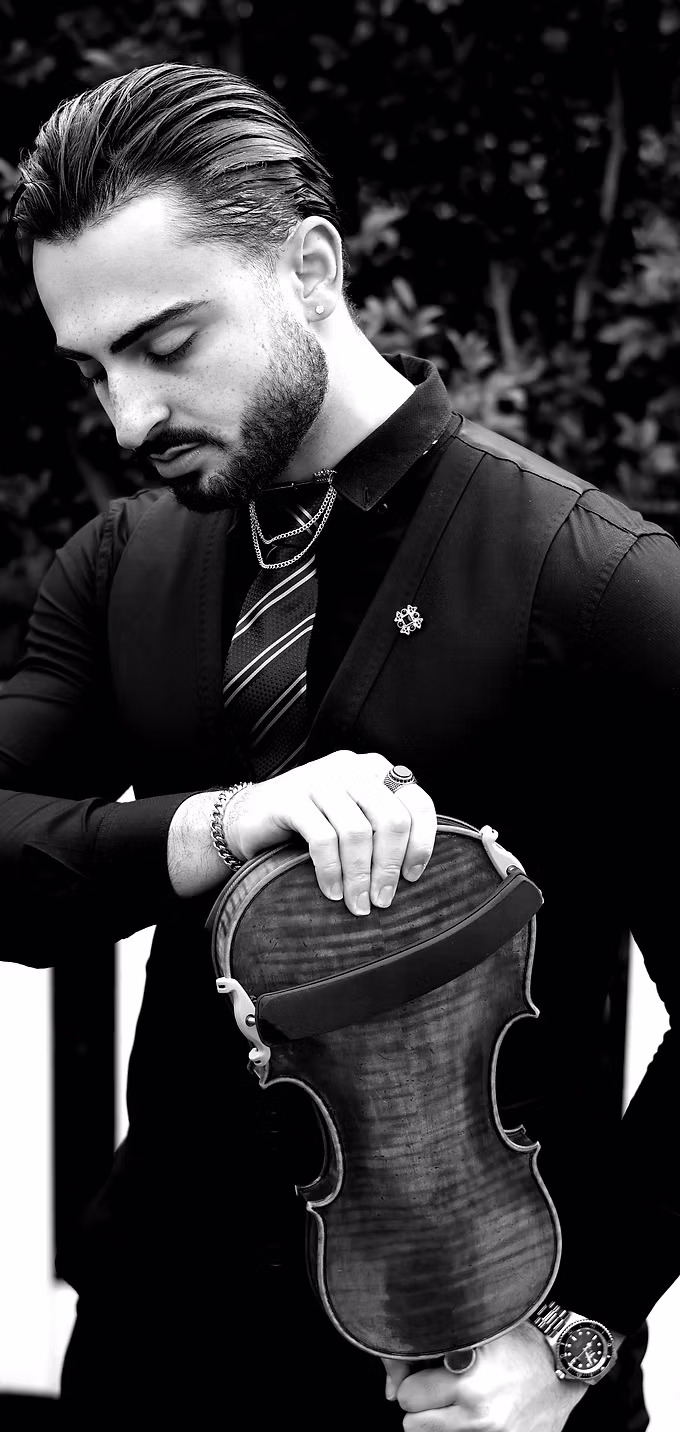 Nima performing violin in formal attire