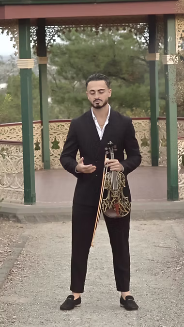 Nima performing violin